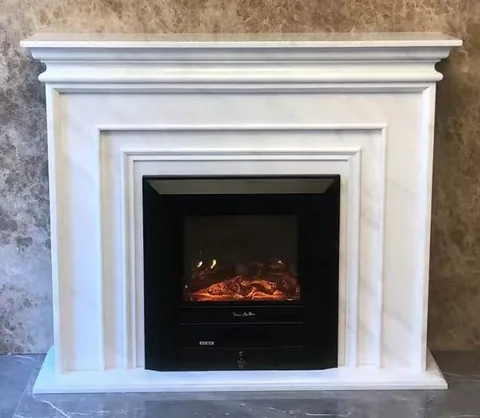 Arabescato Corchia marble fireplace surround, with stepped tiers and fine veining, against a masonry wall