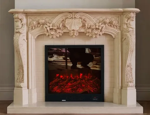White Volakas marble fireplace surround, with carved scrollwork and a plain surface, in a furnished room