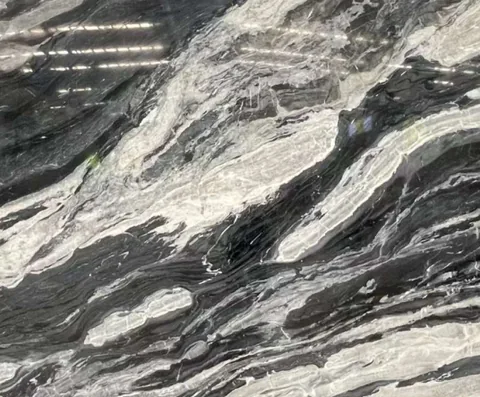 black stone slab, with bold veining and a reflective finish, in a close surface view