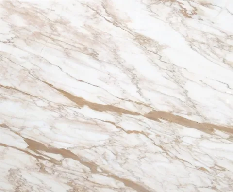 white stone slab, with fine veining, in a close surface view