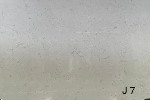 gray engineered stone slab, with cloudy mottling, in a close surface view