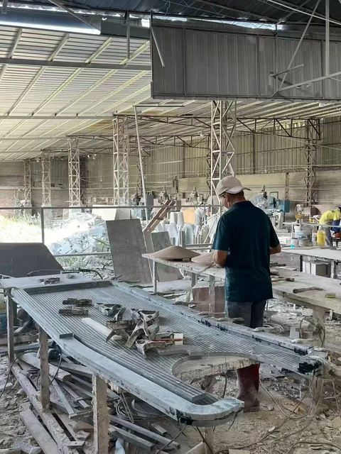 gray stone slab, with a plain surface, in a workshop