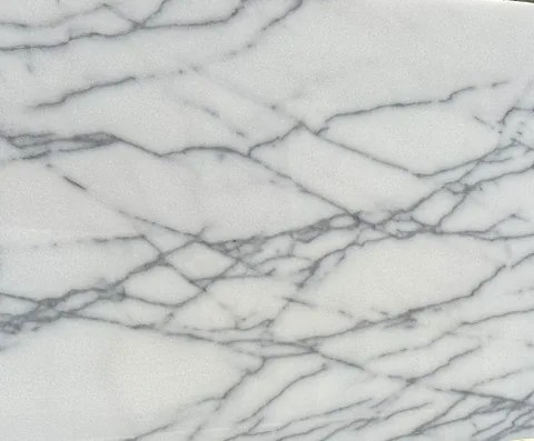 white stone slab, with fine veining, in a close surface view