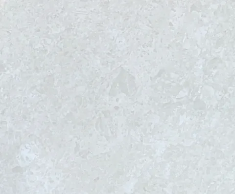 white stone slab, with a single full slab and cloudy mottling, in a close surface view