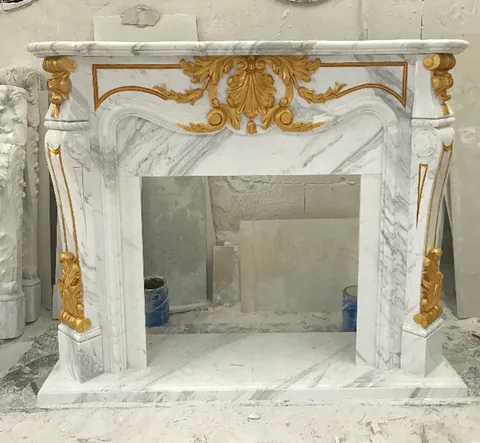 White Volakas marble fireplace surround, with fine veining and a reflective finish, in a workshop