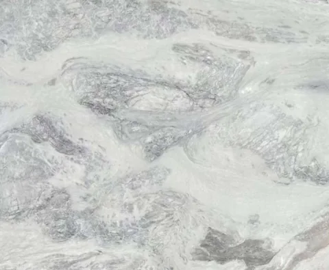 white stone slab, with cloudy mottling, in a close surface view