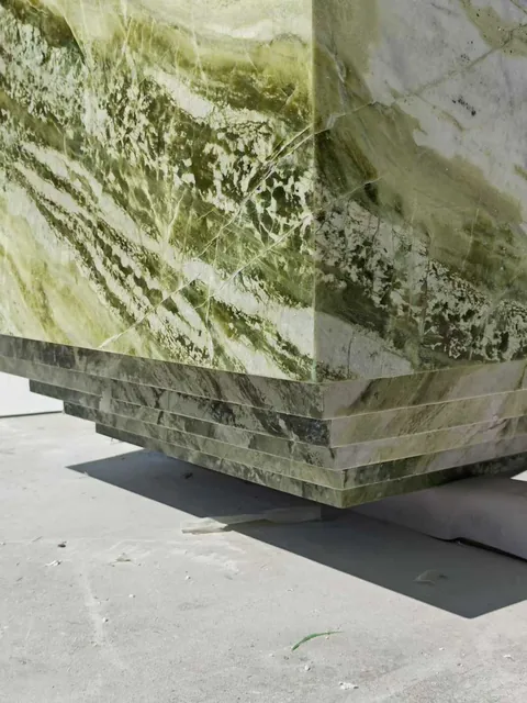 green stone slab, with cloudy mottling and a reflective finish