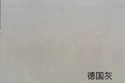 gray engineered stone slab, with cloudy mottling, showing a single main form with closely spaced markings
