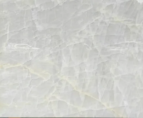 white stone slab, with a single full slab and fine veining, in a close surface view