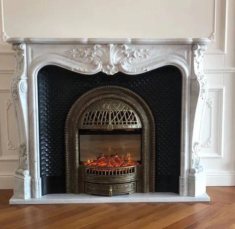 White Volakas marble fireplace surround, with fine veining, showing a single main form with an uncluttered setting