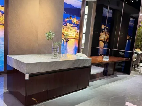 gray stone countertop, with fine veining and a reflective finish, in a showroom