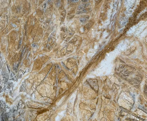 cream-beige stone slab, with a single full slab and bold veining, in a close surface view