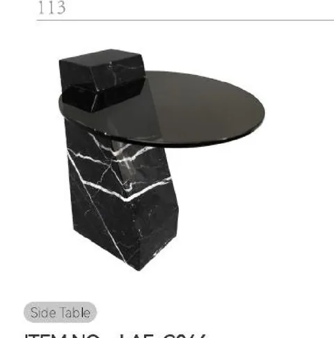 black stone side table, with bold veining and a reflective finish, on a plain backdrop