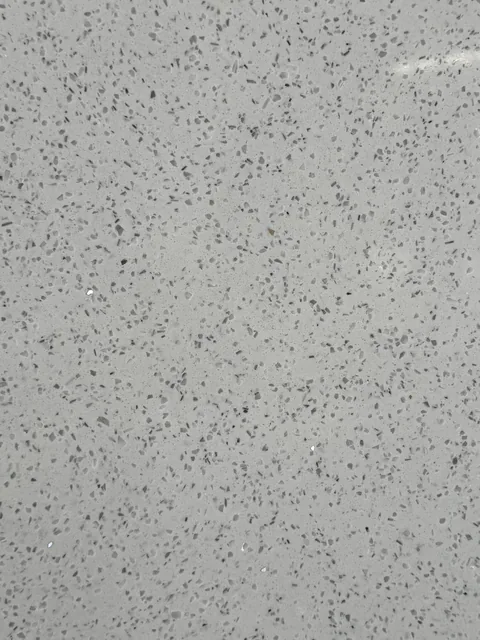gray engineered stone slab, with speckled texture, showing a single main form
