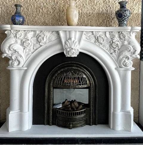 White Volakas marble fireplace surround, with an arched opening and a plain surface, in a furnished room