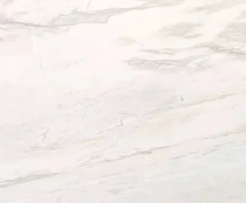 white stone slab, with broad sweeping markings and subtle pattern contrast