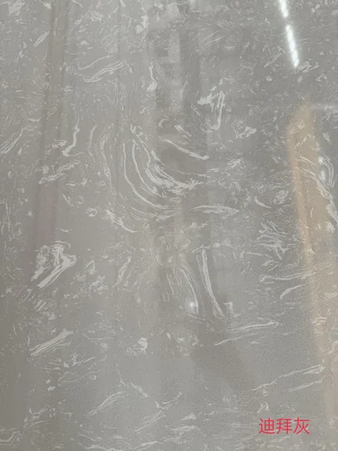 gray engineered stone slab, with a single full slab and fine veining, in a close surface view