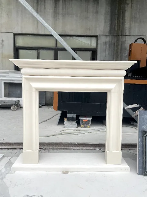 White Volakas marble fireplace surround, with a plain surface, in a workshop