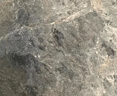 gray stone slab, with a single full slab and fine veining, in a close surface view