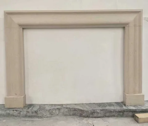 White Volakas marble fireplace surround, with a plain surface and a matte finish, against a pale background