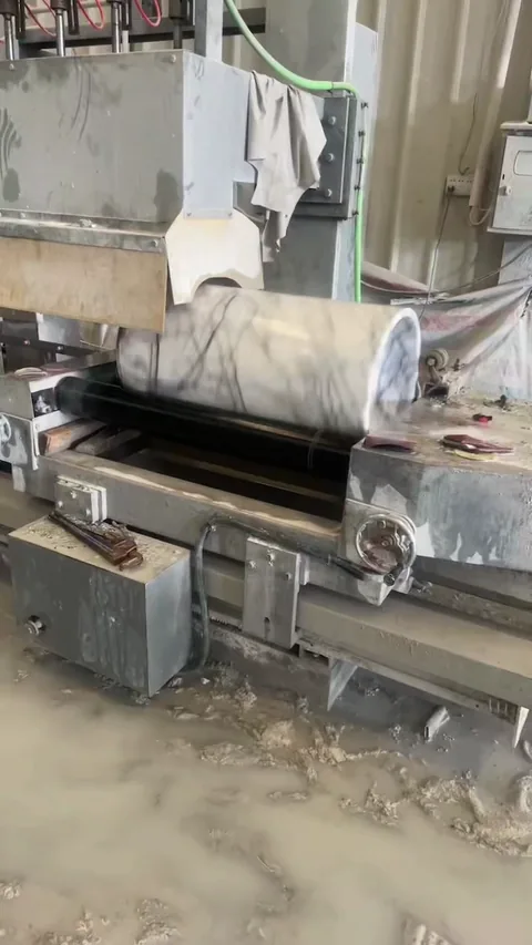 white stone slab, with a single full slab and fine veining, in a workshop