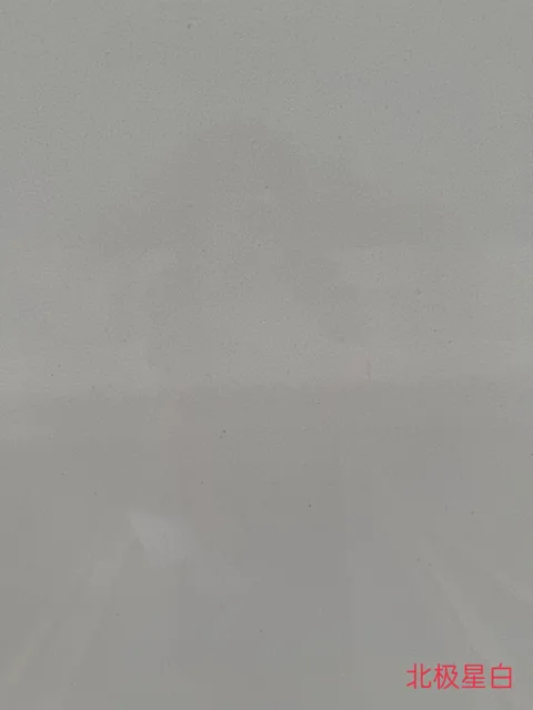 gray engineered stone slab, with a single full slab and a plain surface, in a close surface view