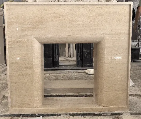 travertine fireplace surround, with linear travertine grain, in a workshop
