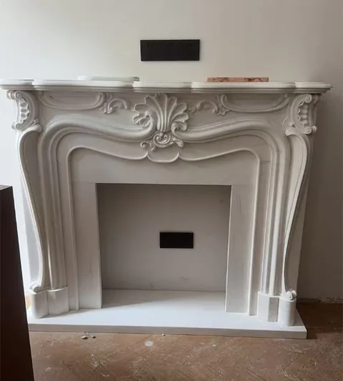 White Volakas marble fireplace surround, with fine veining, shown from a frontal view with subtle pattern contrast