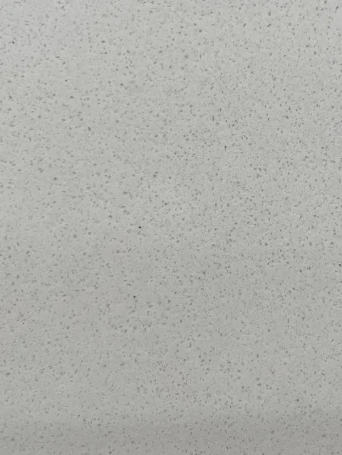 gray engineered stone slab, with speckled texture, shown from an overhead view with single main form