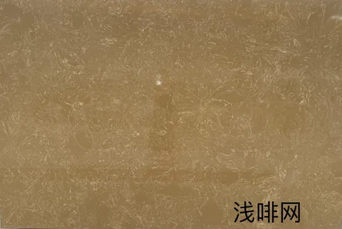 cream-beige engineered stone slab, with cloudy mottling, shown from an overhead view with closely spaced markings