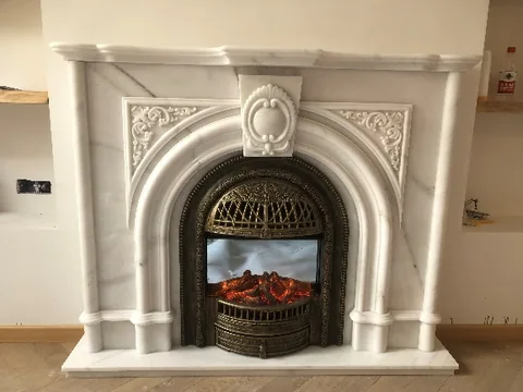 White Volakas marble fireplace surround, shown from a frontal view