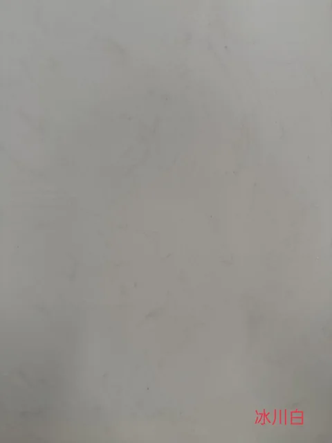gray engineered stone slab, with a single full slab and fine veining, in a close surface view