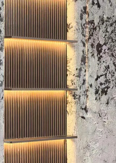 white stone wall feature, with cloudy mottling and a textured finish