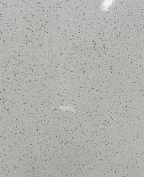 gray engineered stone slab, with speckled texture and subtle pattern contrast and an uncluttered setting
