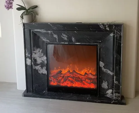 White Volakas marble fireplace surround, showing a single main form with strong pattern contrast