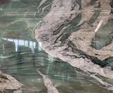green stone slab, with bold veining and a reflective finish, in a close surface view