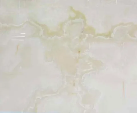 cream-beige stone slab, with a single full slab and cloudy mottling, in a close surface view