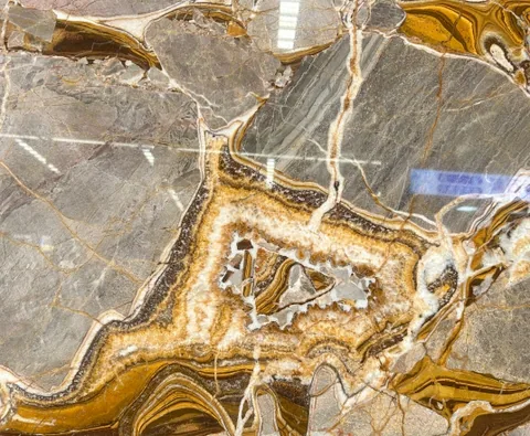 gray stone slab, with a single full slab and banded onyx-like striping, in a close surface view