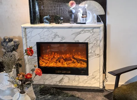 Arabescato Corchia marble fireplace surround, with fine veining and a reflective finish, in a furnished room
