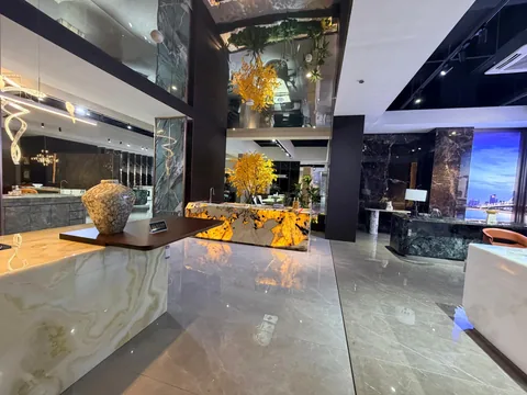 gray stone countertop, with bold veining and a reflective finish, in a showroom