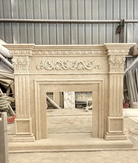 White Volakas marble fireplace surround, with a plain surface, in a workshop