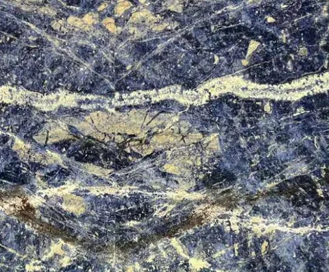 blue stone slab, with bold veining, in a close surface view
