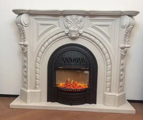 White Volakas marble fireplace surround, with an arched opening and a plain surface, against a pale background