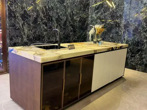 black stone countertop, with bold veining and a reflective finish, in a showroom