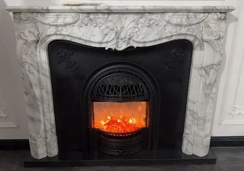 White Volakas marble fireplace surround, showing a single main form