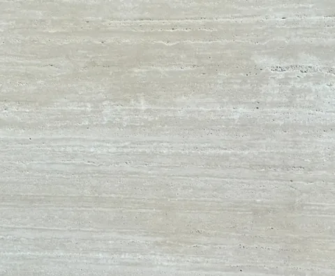 cream-beige stone slab, with linear travertine grain and a matte finish, in a close surface view