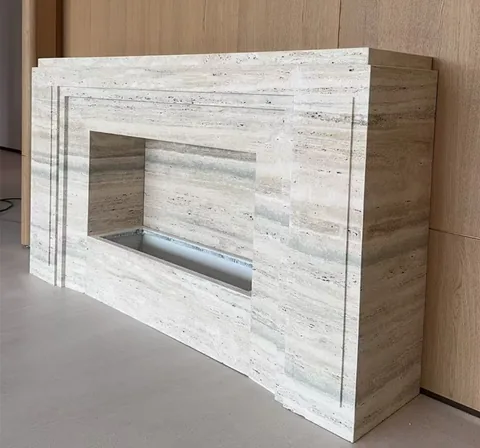 travertine fireplace surround, with stepped tiers and linear travertine grain, near warm woodwork