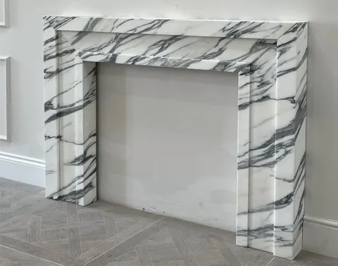 Arabescato Corchia marble fireplace surround, with bold veining and broad sweeping markings and strong pattern contrast