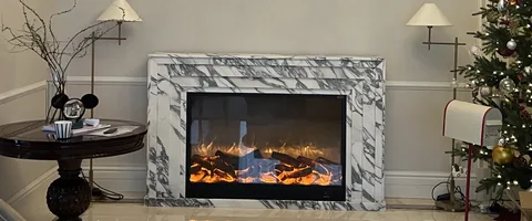 Arabescato Corchia marble fireplace surround, showing a single main form