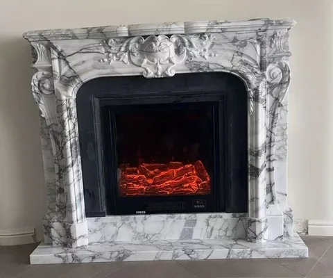 White Volakas marble fireplace surround, with bold veining and a reflective finish, in a furnished room